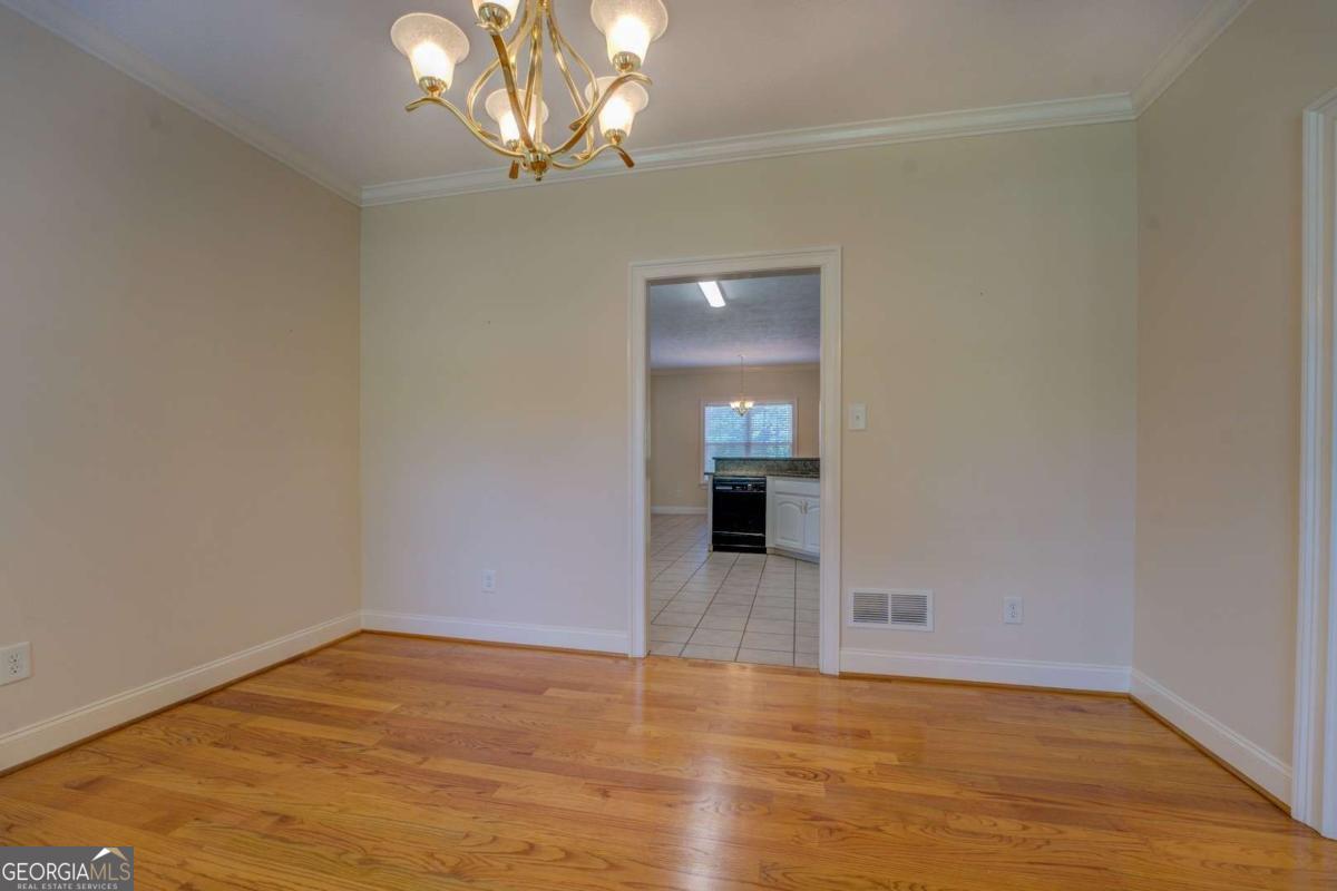 212 Willow Ridge Lane Jackson, GA 30233 - Photo 22 of 45 a view of empty room with wooden floor