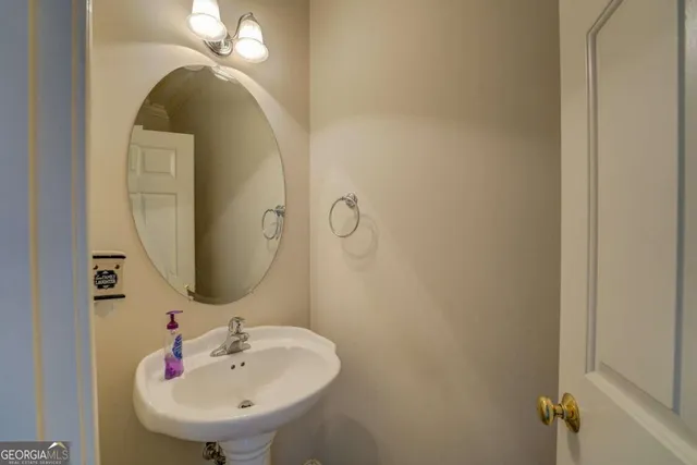 a bathroom with a sink and mirror