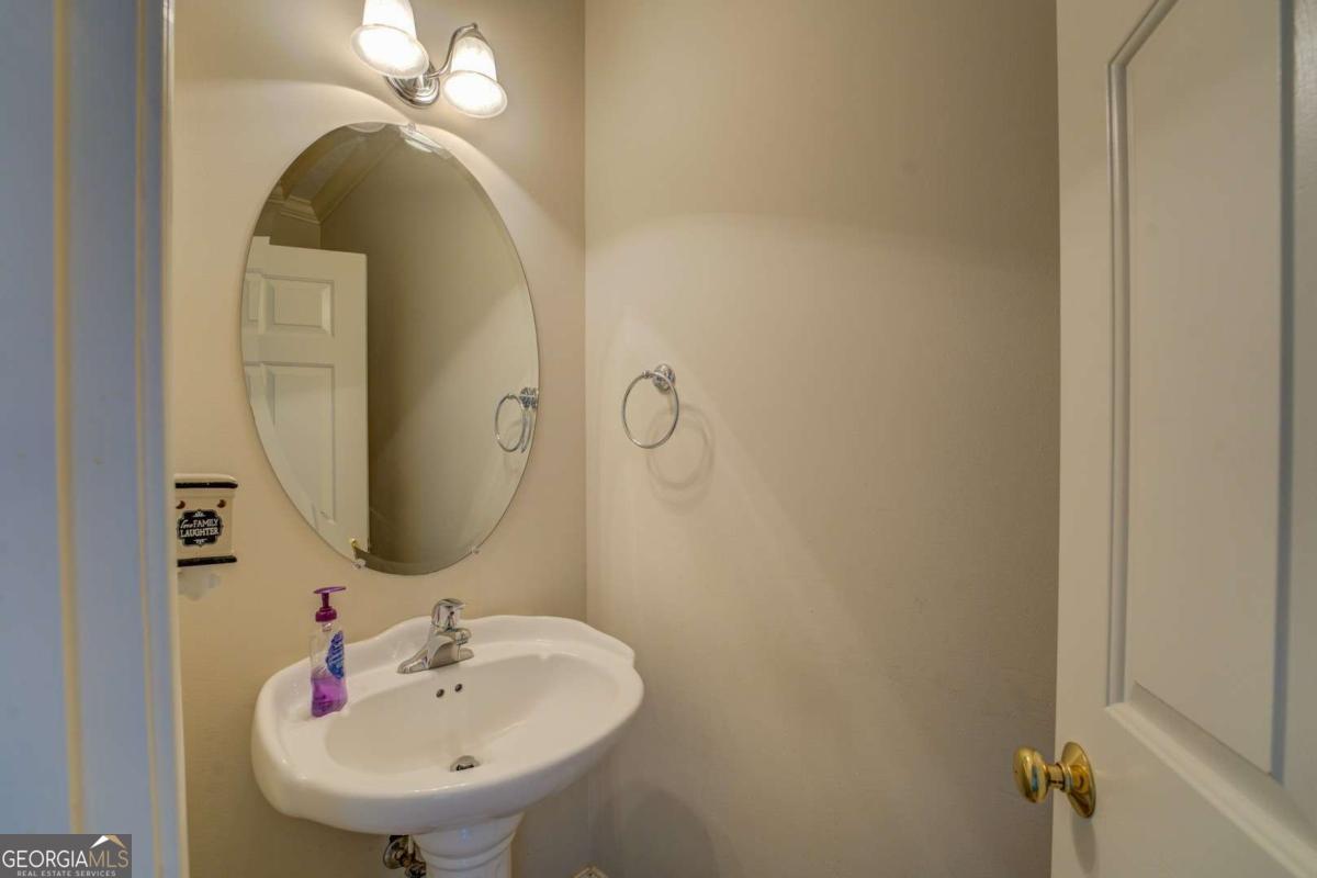 212 Willow Ridge Lane Jackson, GA 30233 - Photo 33 of 45 a bathroom with a sink and mirror
