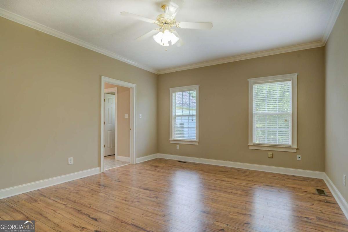 212 Willow Ridge Lane Jackson, GA 30233 - Photo 39 of 45 a view of an empty room with window and wooden floor