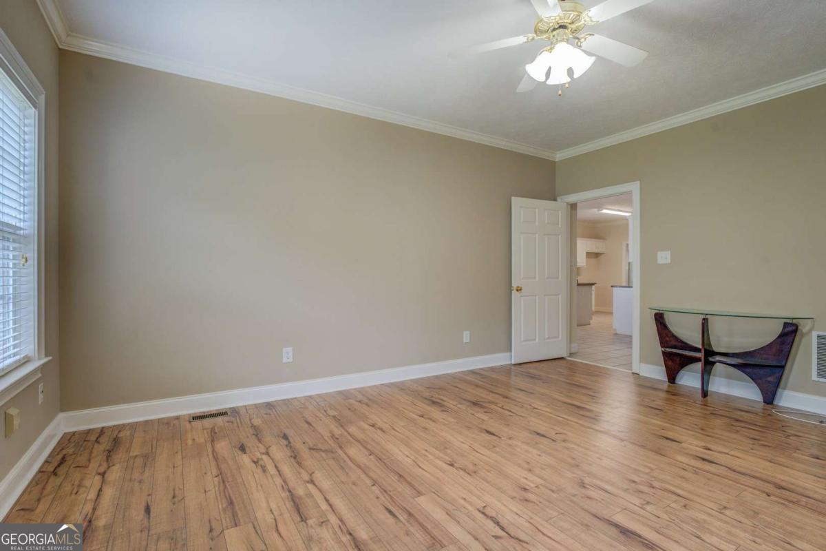 212 Willow Ridge Lane Jackson, GA 30233 - Photo 40 of 45 wooden floor in an empty room with a window