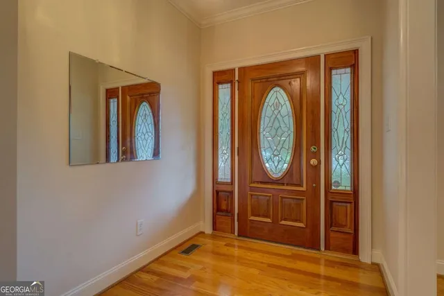 a view of front door with wooden door
