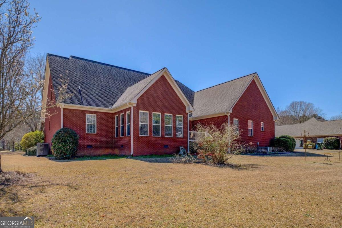 212 Willow Ridge Lane Jackson, GA 30233 - Photo 44 of 45 front view of a house next to a yard