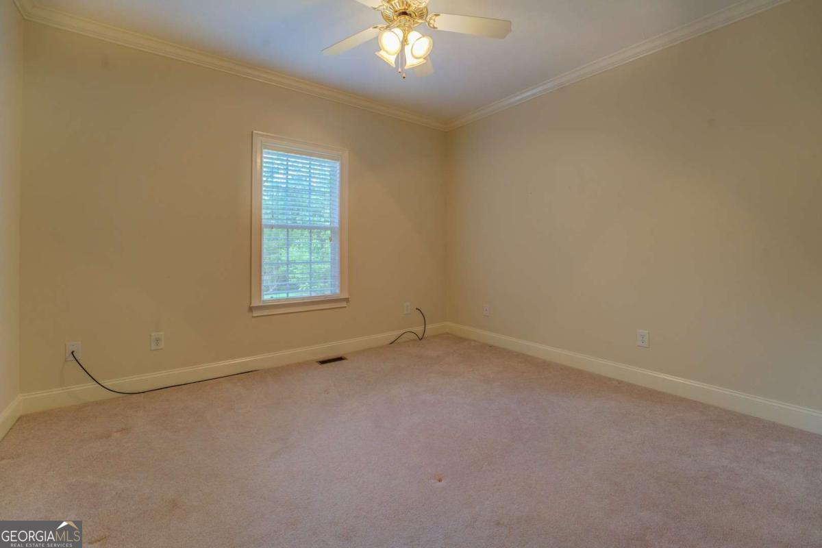 212 Willow Ridge Lane Jackson, GA 30233 - Photo 6 of 45 an empty room with a window