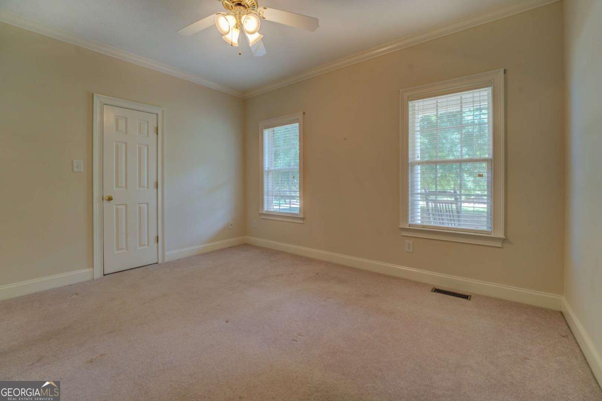 212 Willow Ridge Lane Jackson, GA 30233 - Photo 7 of 45 a view of an empty room with a window
