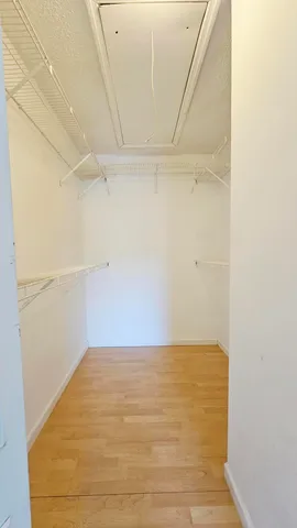 a bathroom with a sink a toilet a shower and a mirror