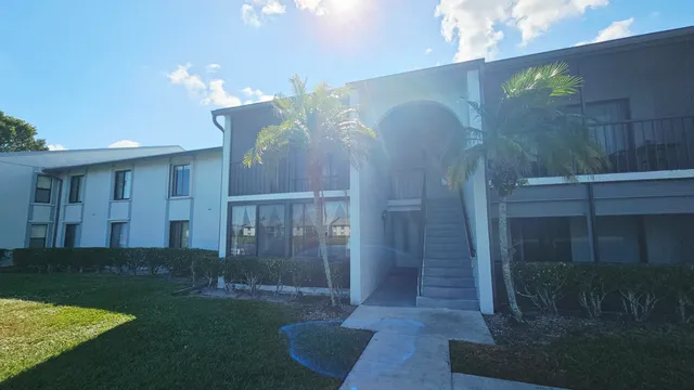 a view of a lake with houses in the background