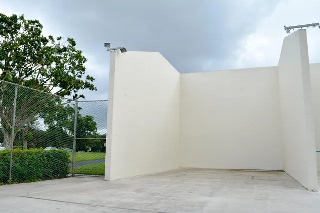 a view of a lake with houses and a yard