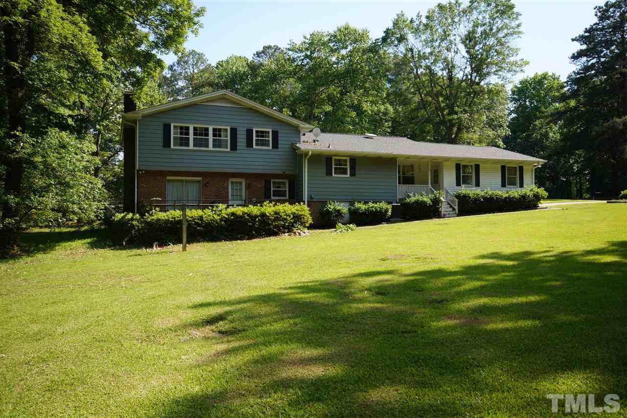 8920 Oneal Road Raleigh, NC 27613 - Photo 22 of 22 a view of a house with a yard