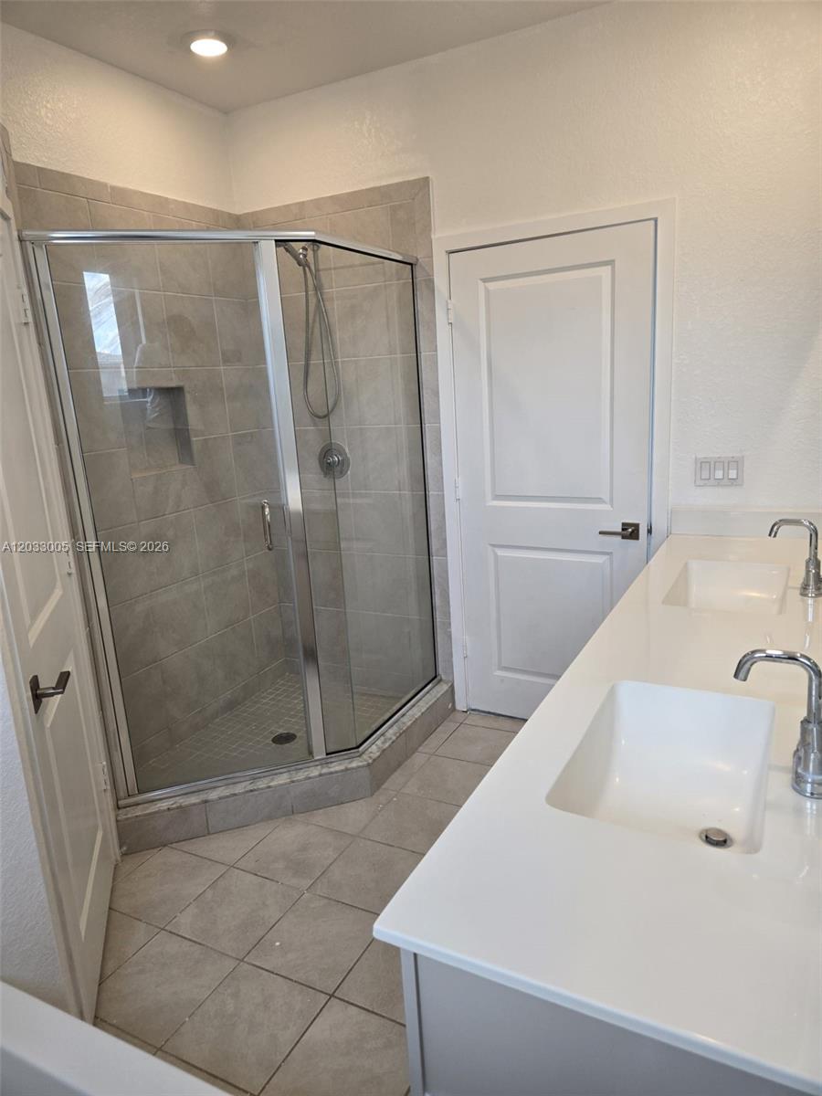 862 Southeast 17 Street, Unit 862 Homestead, FL 33034 - Photo 16 of 39 a bathroom with a shower and a sink