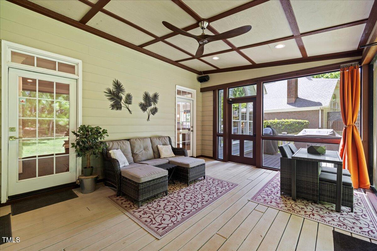 6819 Rainwater Road Raleigh, NC 27615 - Photo 54 of 67 a living room with furniture and a fireplace