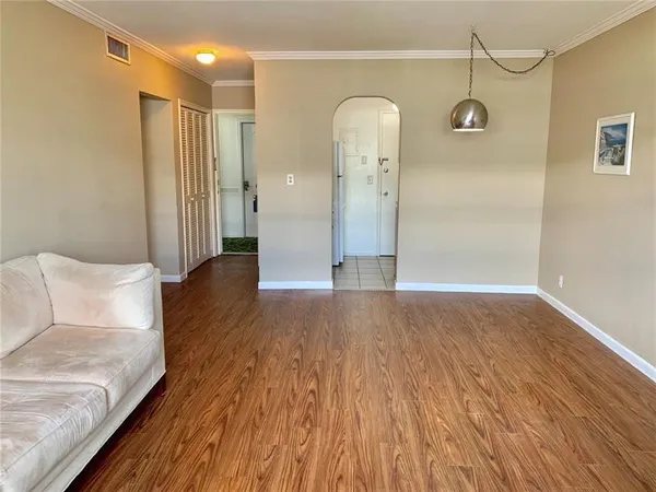 a view of livingroom with hardwood floor and a ceiling fan