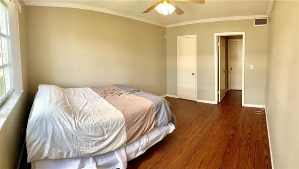 a bedroom with a bed and a mirror