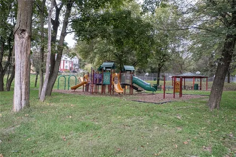 a view of a park with swings