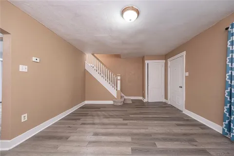 a view of an empty room with stairs