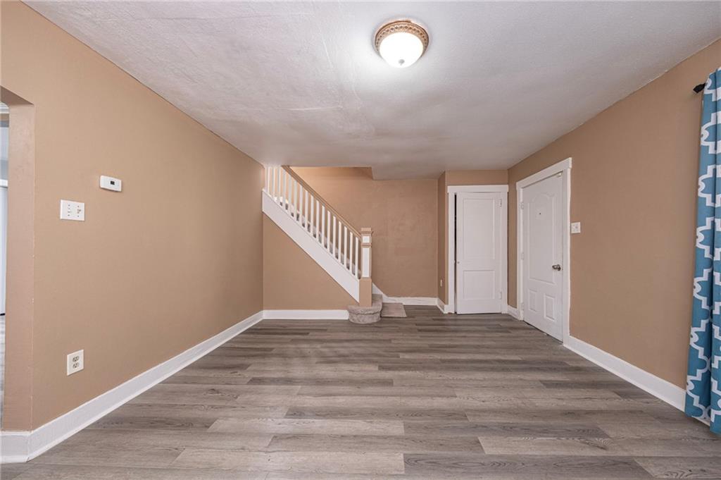 1536 Hunter Street Pittsburgh, PA 15221 - Photo 4 of 18 a view of an empty room with stairs