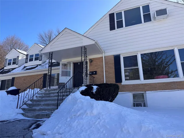 a view of a house with wooden stairs