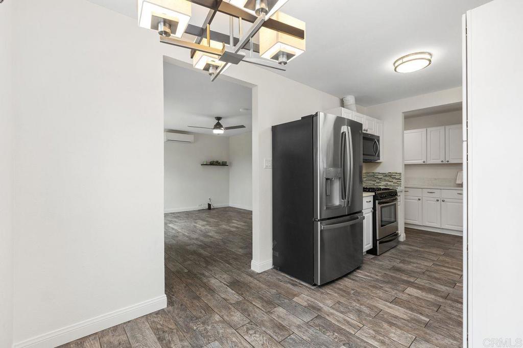 3518 Capalina Road San Marcos, CA 92069 - Photo 13 of 34 a kitchen with stainless steel appliances a refrigerator and a chandelier