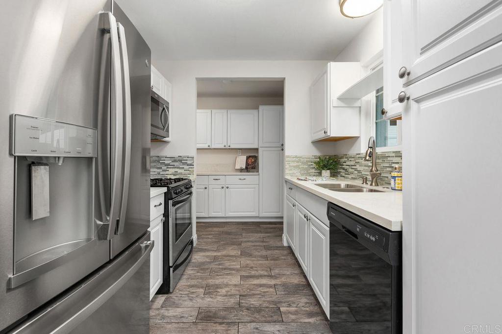 3518 Capalina Road San Marcos, CA 92069 - Photo 14 of 34 a kitchen with stainless steel appliances granite countertop a refrigerator and a stove
