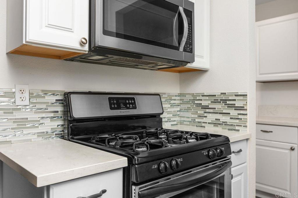 3518 Capalina Road San Marcos, CA 92069 - Photo 16 of 34 a stove top oven sitting inside of a kitchen