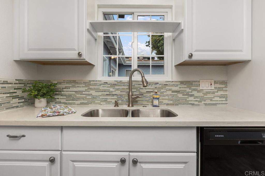 3518 Capalina Road San Marcos, CA 92069 - Photo 17 of 34 a kitchen with a sink and cabinets