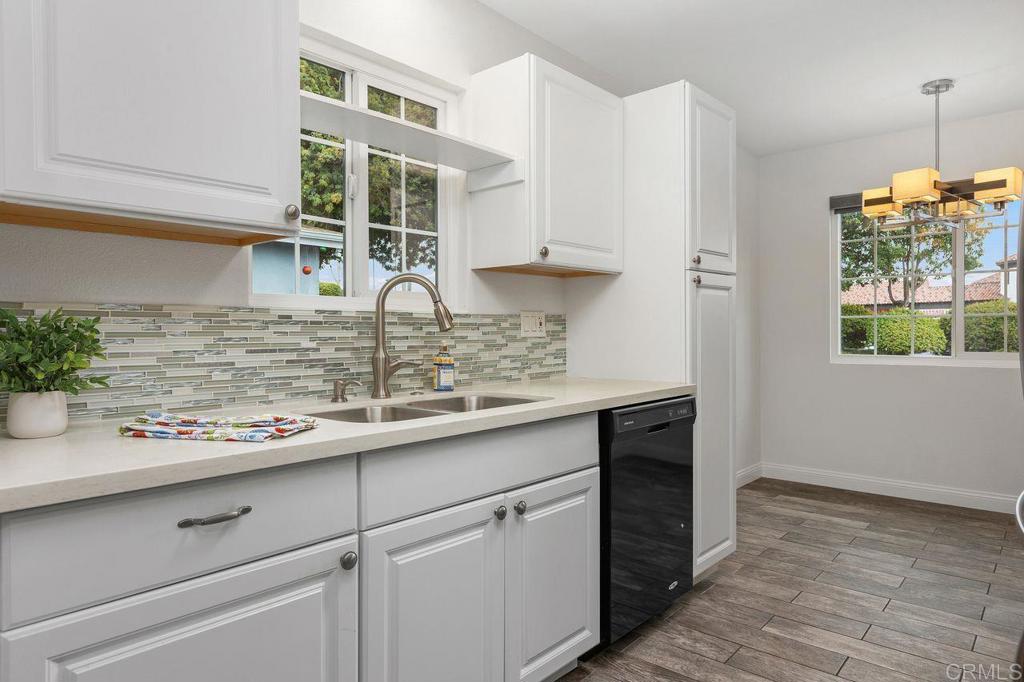 3518 Capalina Road San Marcos, CA 92069 - Photo 18 of 34 a kitchen with a sink and cabinets