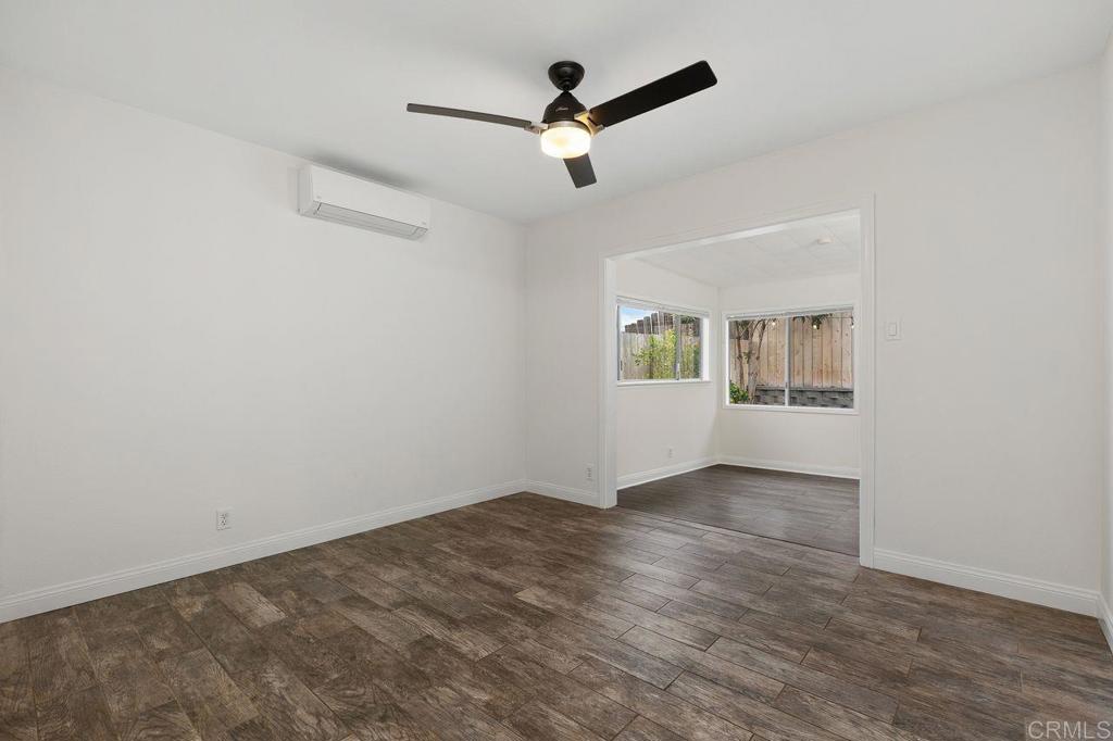 3518 Capalina Road San Marcos, CA 92069 - Photo 24 of 34 an empty room with wooden floor and windows