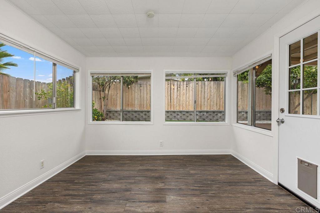 3518 Capalina Road San Marcos, CA 92069 - Photo 26 of 34 a view of an empty room with wooden floor and a window