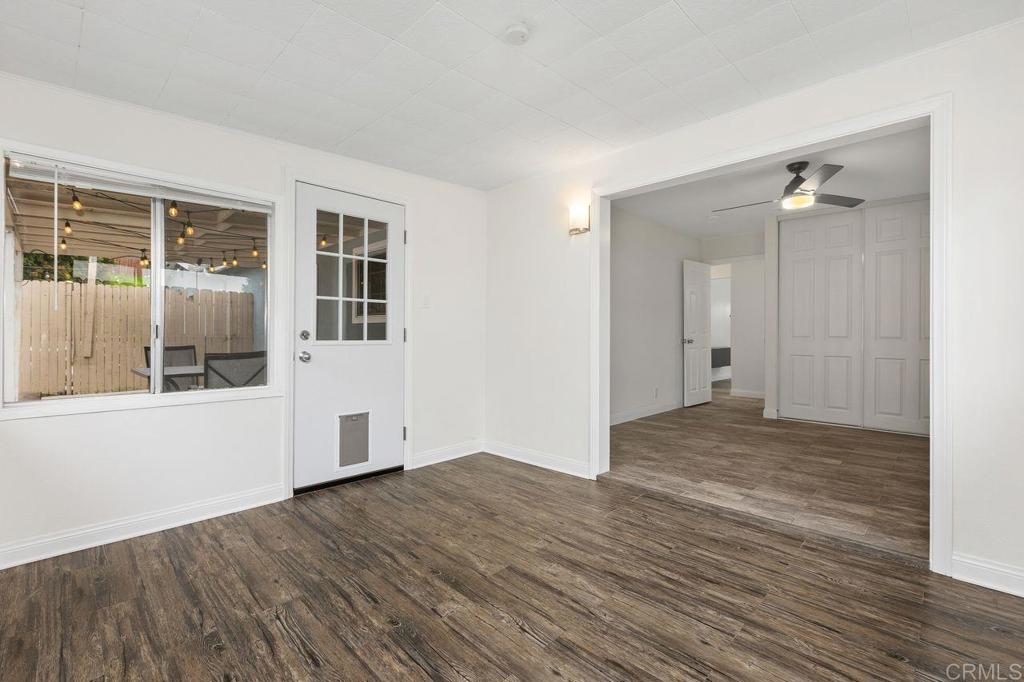 3518 Capalina Road San Marcos, CA 92069 - Photo 27 of 34 a view of an empty room with wooden floor and a window