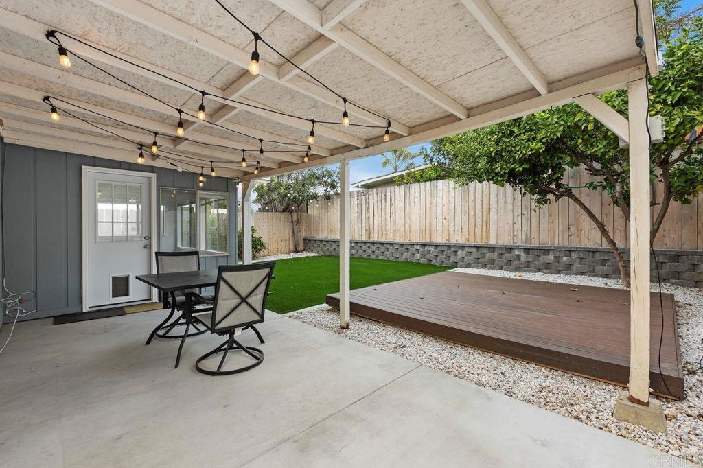3518 Capalina Road San Marcos, CA 92069 - Photo 28 of 34 a view of a backyard with table and chairs