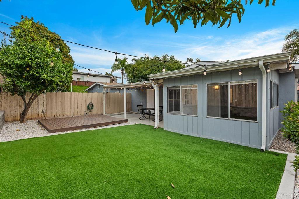 3518 Capalina Road San Marcos, CA 92069 - Photo 31 of 34 front view of a house with a yard and a large tree