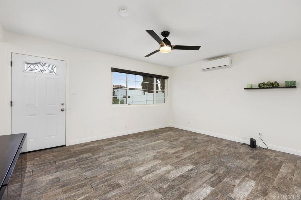 3518 Capalina Road San Marcos, CA 92069 - Photo 9 of 34 a view of a big room with wooden floor and windows