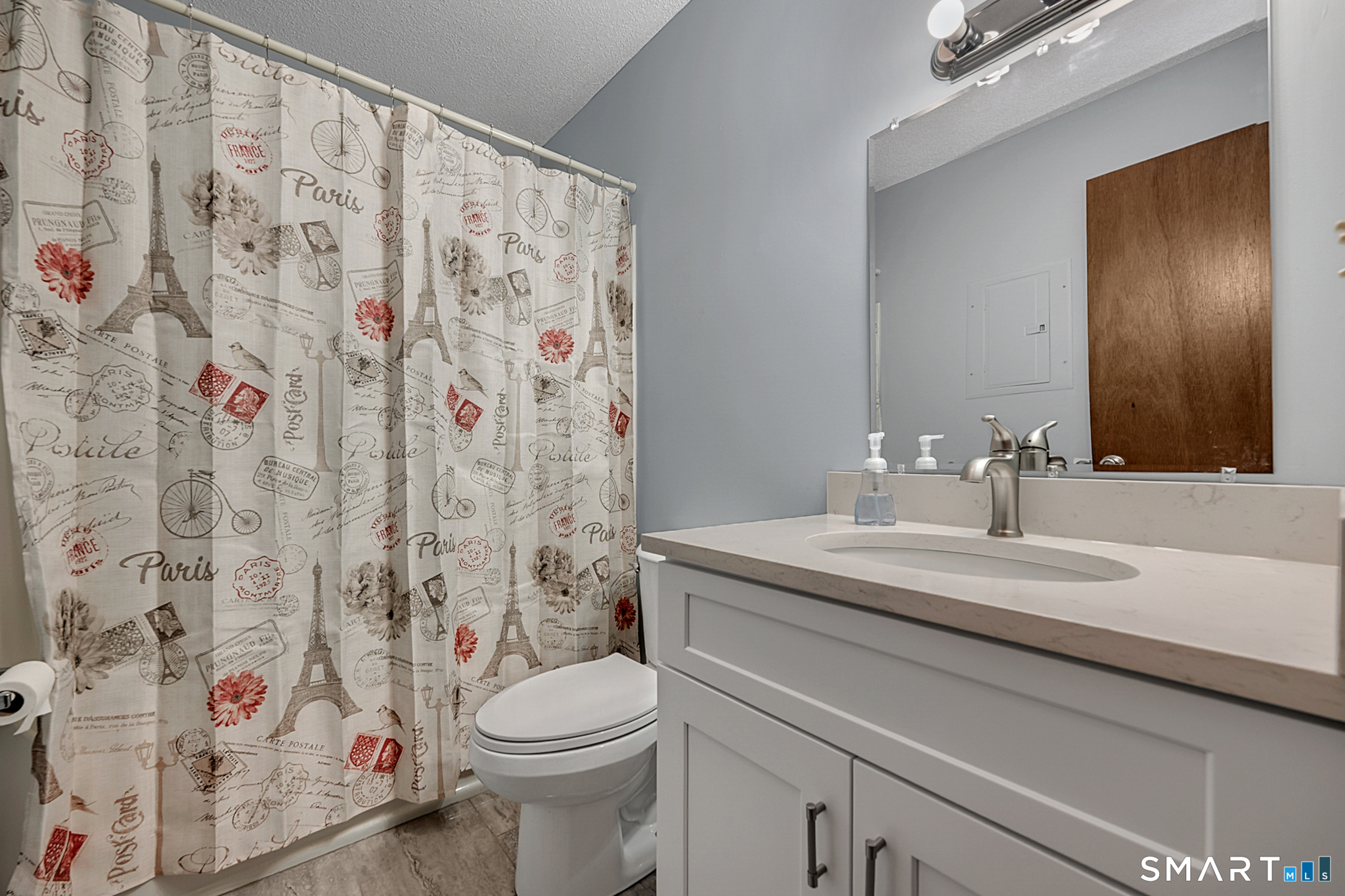 81 Chipman Street, Unit 13 Waterbury, CT 06708 - Photo 10 of 11 a bathroom with a sink toilet and shower curtain