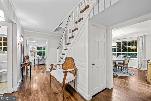 a view of a livingroom with furniture and hardwood floor