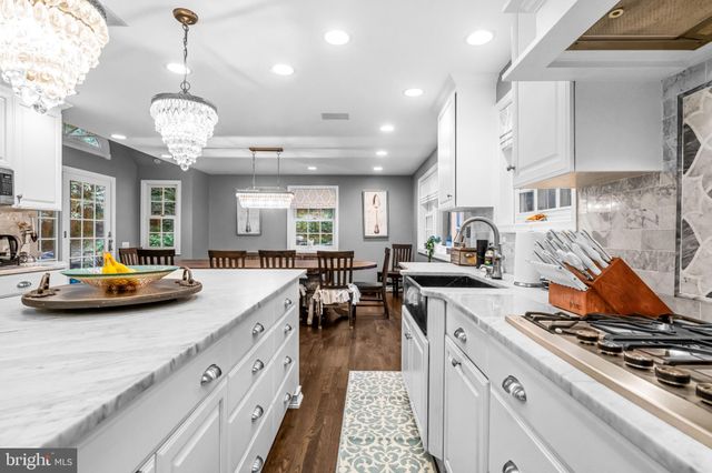 a kitchen with stove and cabinets