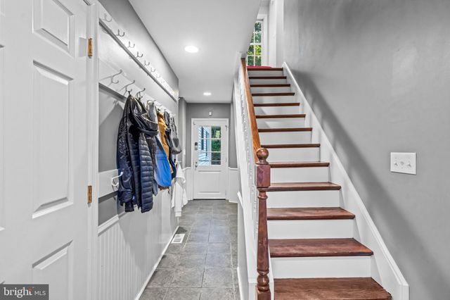 a bed room with a bed and a chandelier