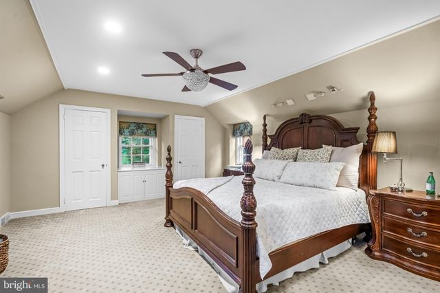 a bed room with a bed and a chandelier