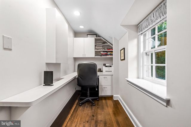 a bedroom with furniture and wooden floor