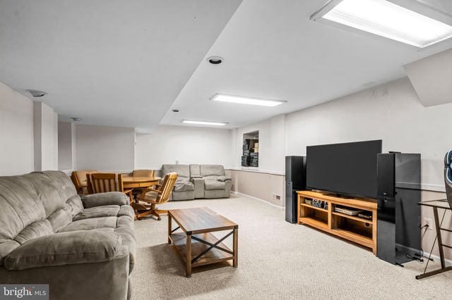 a table and chairs in front of a house