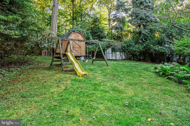 a view of a house with a yard and garage