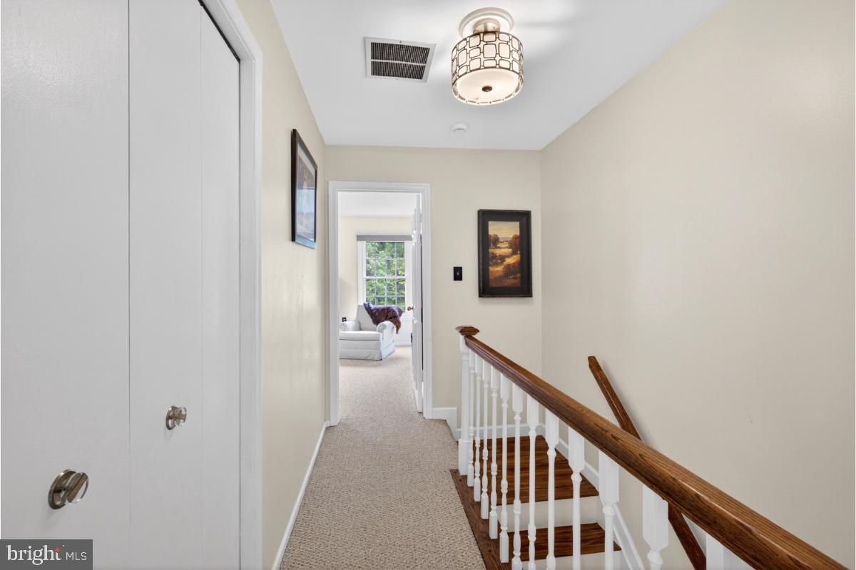 7347 Swan Point Way, Unit 122 Columbia, MD 21045 - Photo 18 of 54 a view of a hallway to a livingroom with furniture