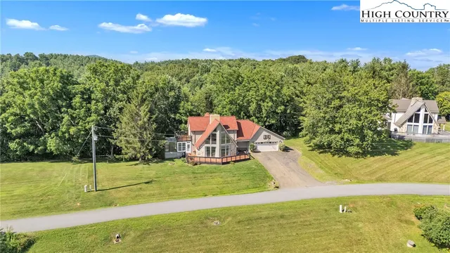 a view of a yard with swimming pool