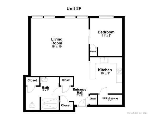 a city street filled with traffic and tall buildings