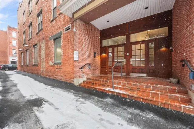 a view of a building with a yard