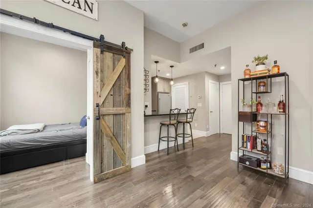 a view of a livingroom with furniture and wooden floor