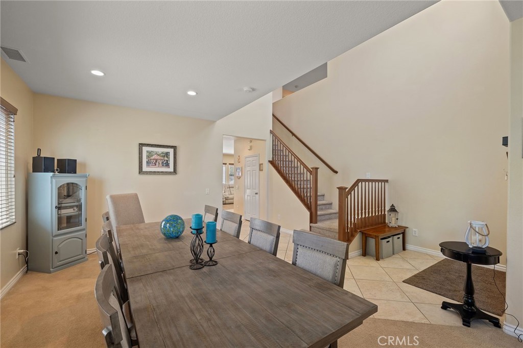 1729 Isabella Way Upland, CA 91784 - Photo 11 of 43 a dining room with furniture and a table