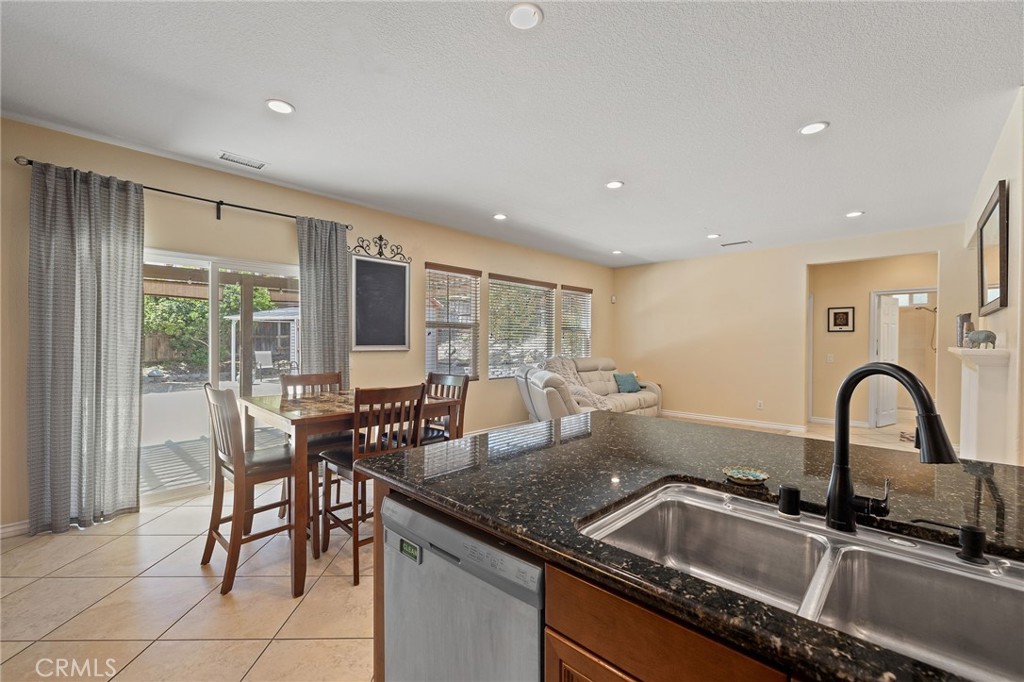 1729 Isabella Way Upland, CA 91784 - Photo 22 of 43 a kitchen with a sink and breakfast area