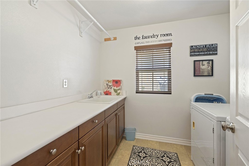 1729 Isabella Way Upland, CA 91784 - Photo 30 of 43 a bathroom with a sink and a window