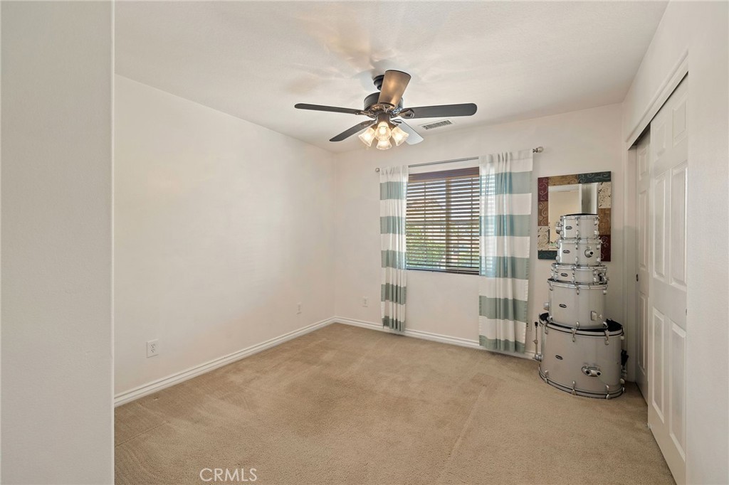 1729 Isabella Way Upland, CA 91784 - Photo 33 of 43 a room with a white bed and a chandelier