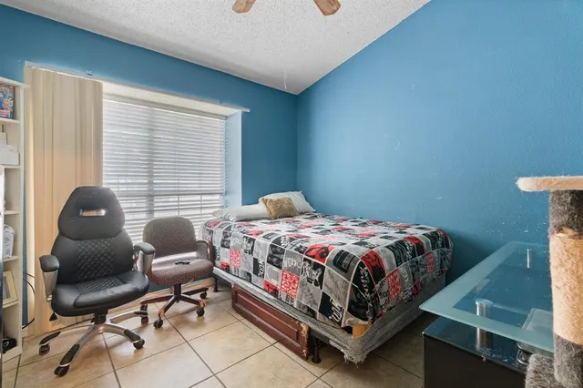 a bedroom with a bed and cabinets